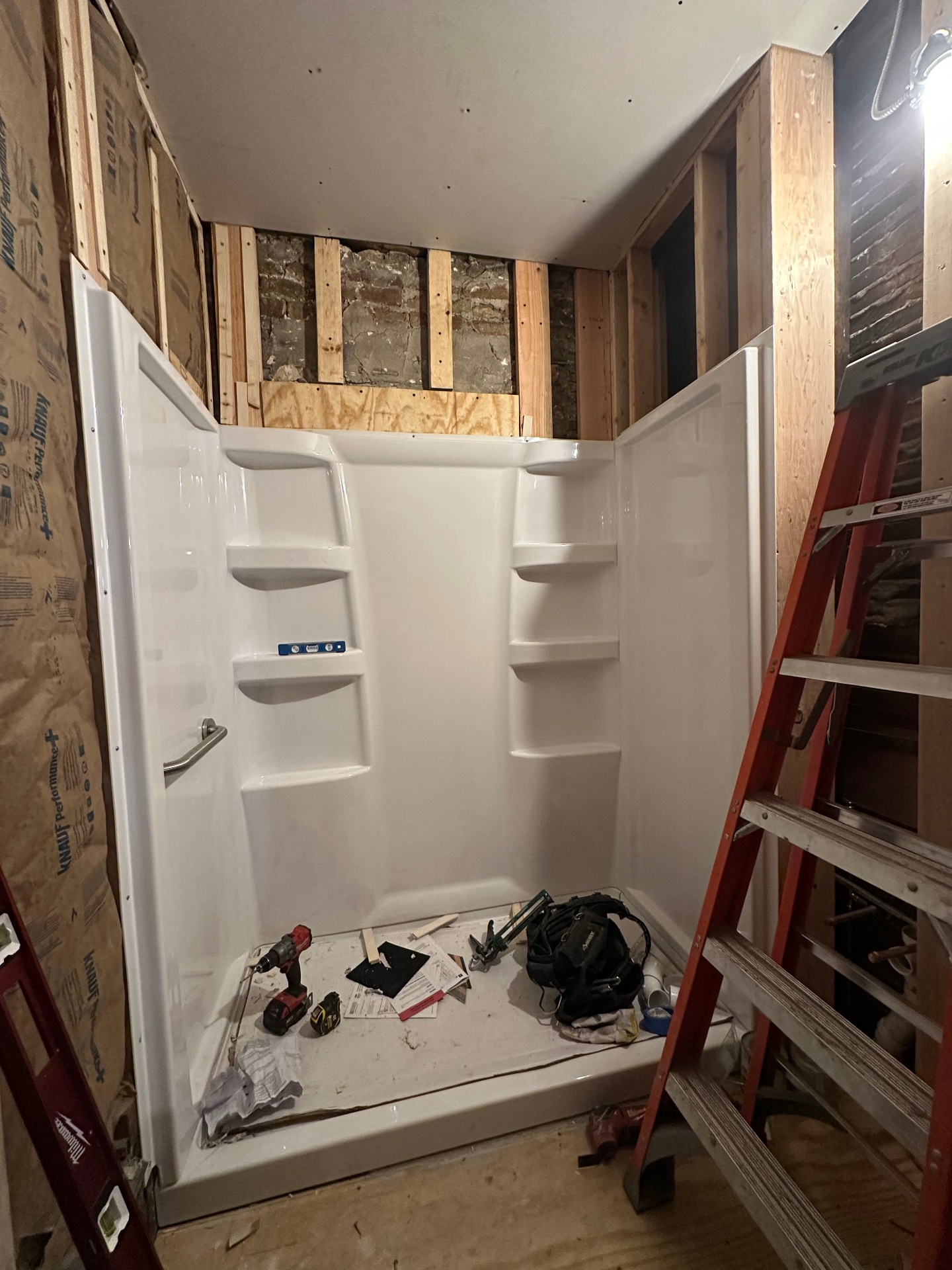Bathroom shower surround patch - Before - surround set, framing exposed (Deerfield, IL drywall project)