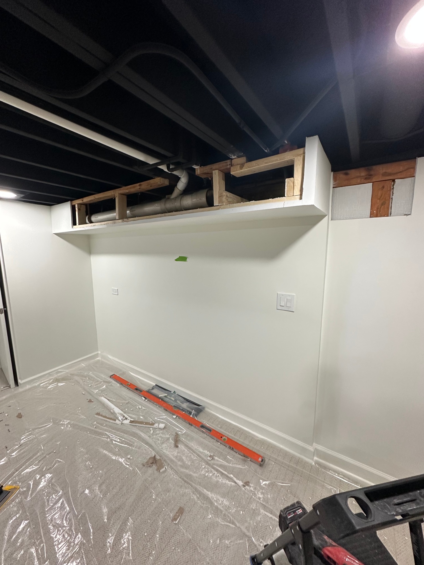 Basement soffit build & finish - In progress - soffit framed around utilities (Buffalo Grove, IL drywall project)