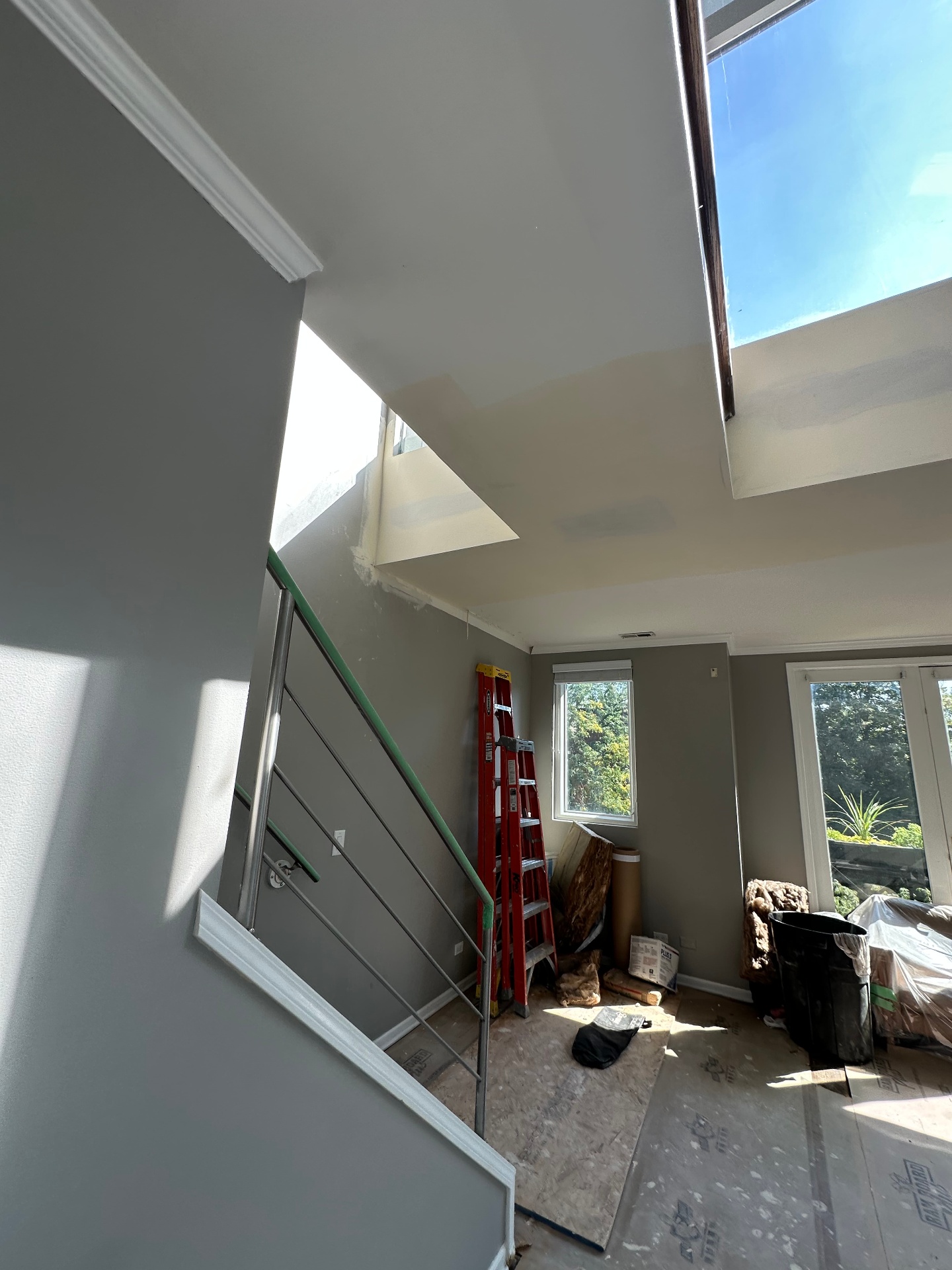 Vaulted great room ceiling rebuild - After - stairwell + skylight blend (Highland Park, IL drywall project)
