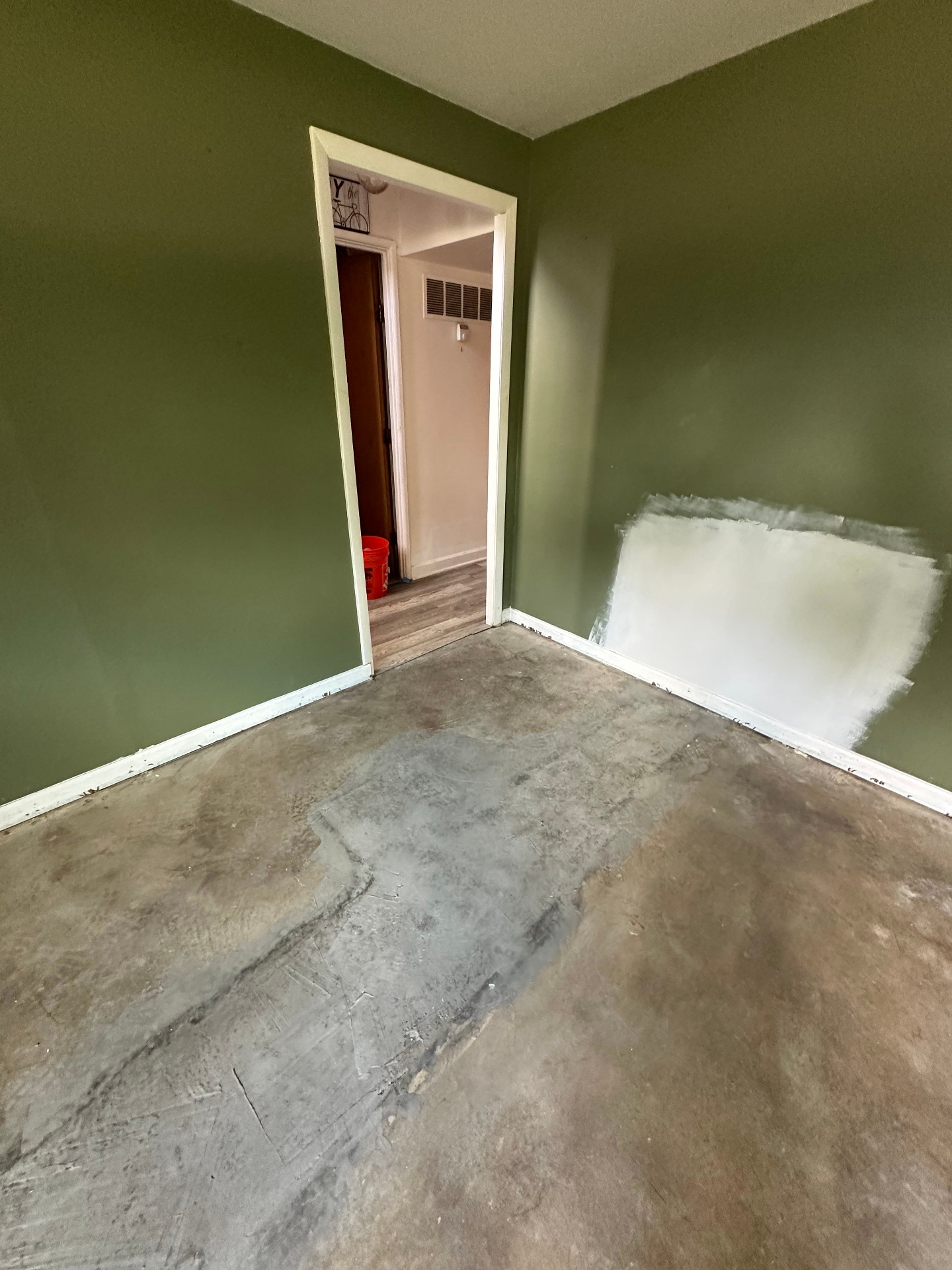 Interior wall patch - In progress - patch taped and mudded (Schaumburg, IL drywall project)